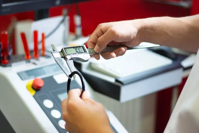 a person using a calculator on a machine